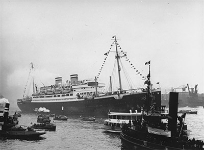 View of the MS St. Louis surrounded by smaller vessels in the port of Hamburg. thumbnail page 1