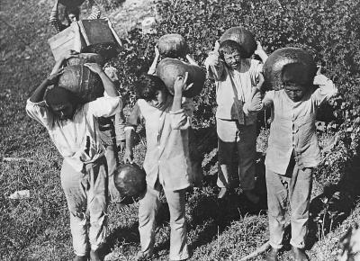 Load Workers Carrying Rubber to a Boat, 1915 in Main Document Viewer