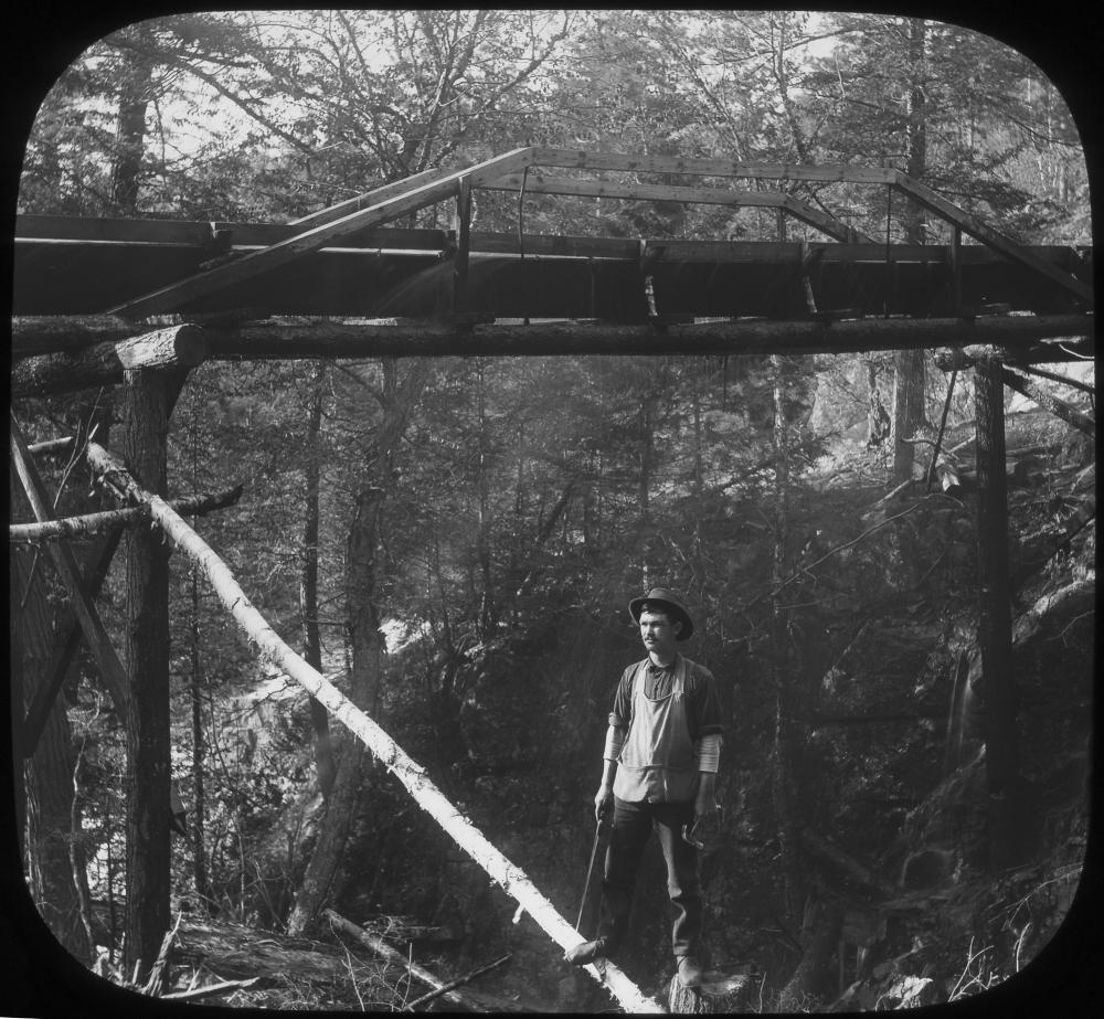 Lumber slide at the highest point of its trestle, Adirondacks, c. 1900 page 1