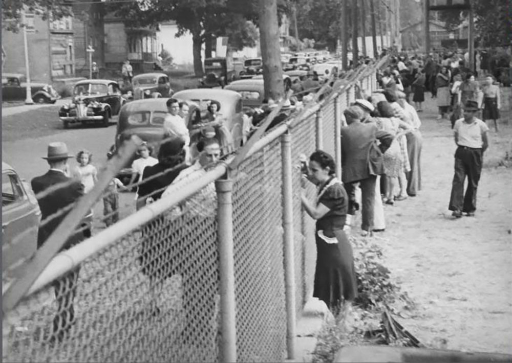 Woman at the fence of Fort Ontario page 1