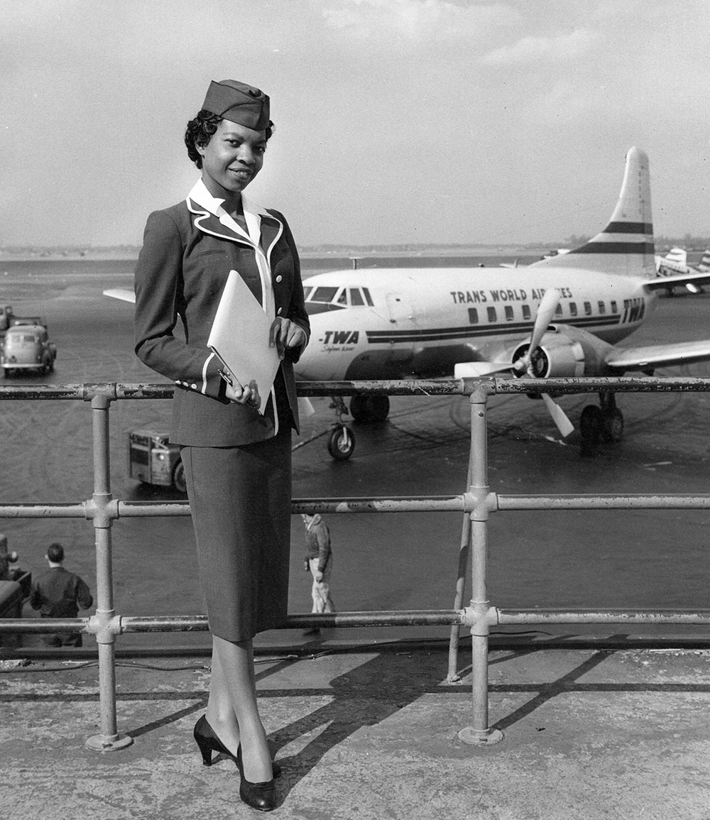 Dorothy Franklin standing by a Trans World Airlines plane at LaGuardia Airport page 1