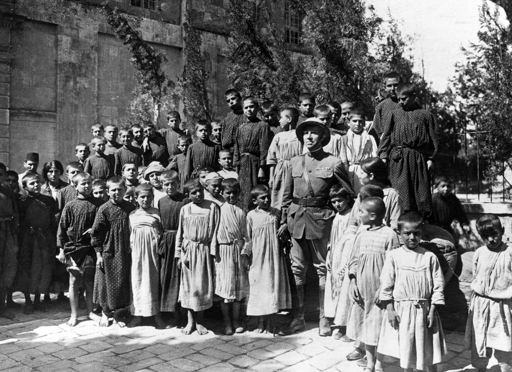 Photograph of Dr. John H. Finley of the Armenian Relief Effort with Armenian children, 1918 page 1