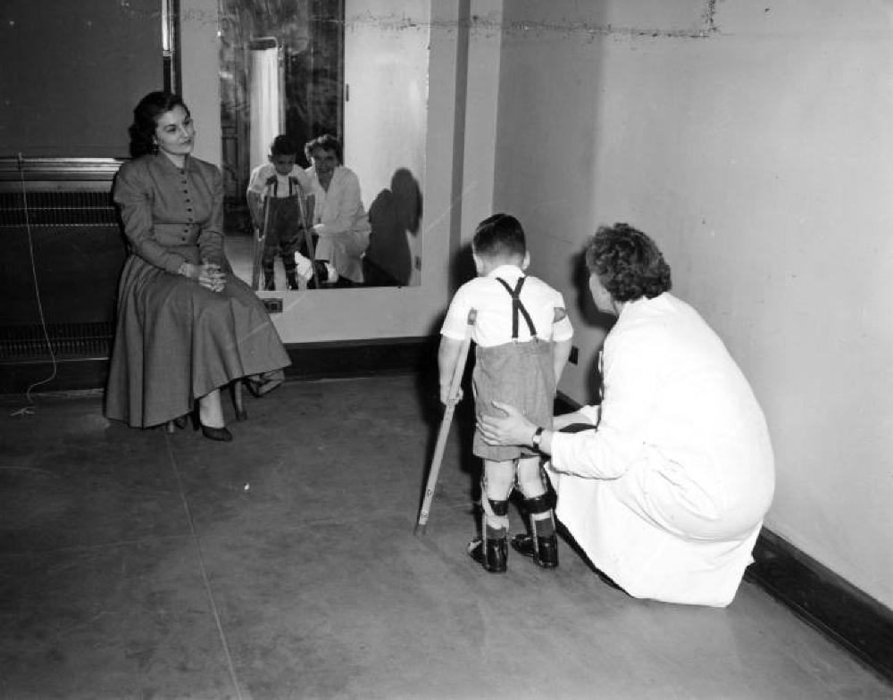 Boy Walking with Braces on His Legs, c. 1940s page 1