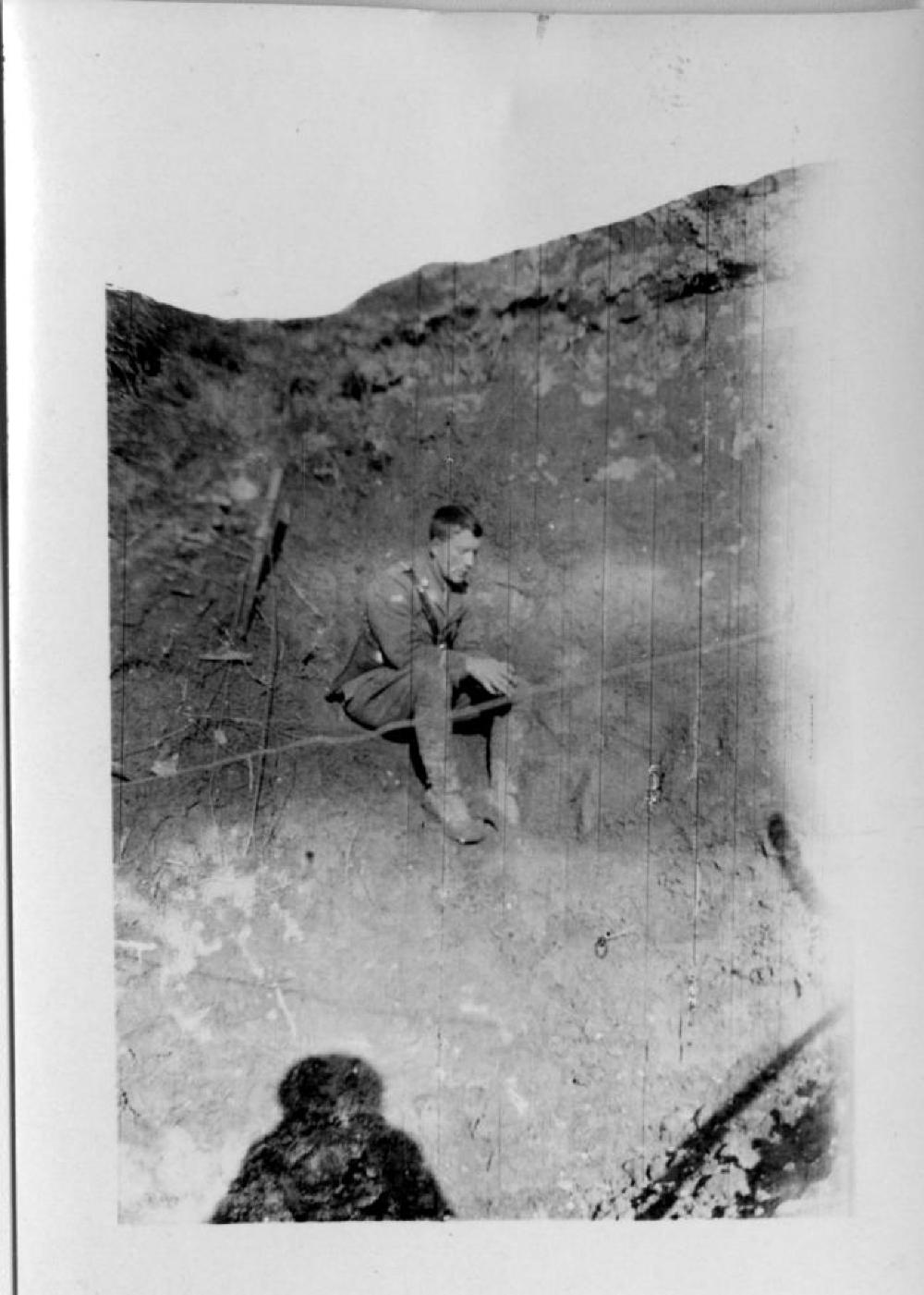 Lieutenant James A. McGuire in Shell Hole, World War I, France, 1918 page 1